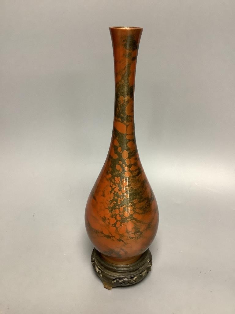 A Japanese patinated bronze bottle vase, early 20th century, with hardwood stand 26cm total